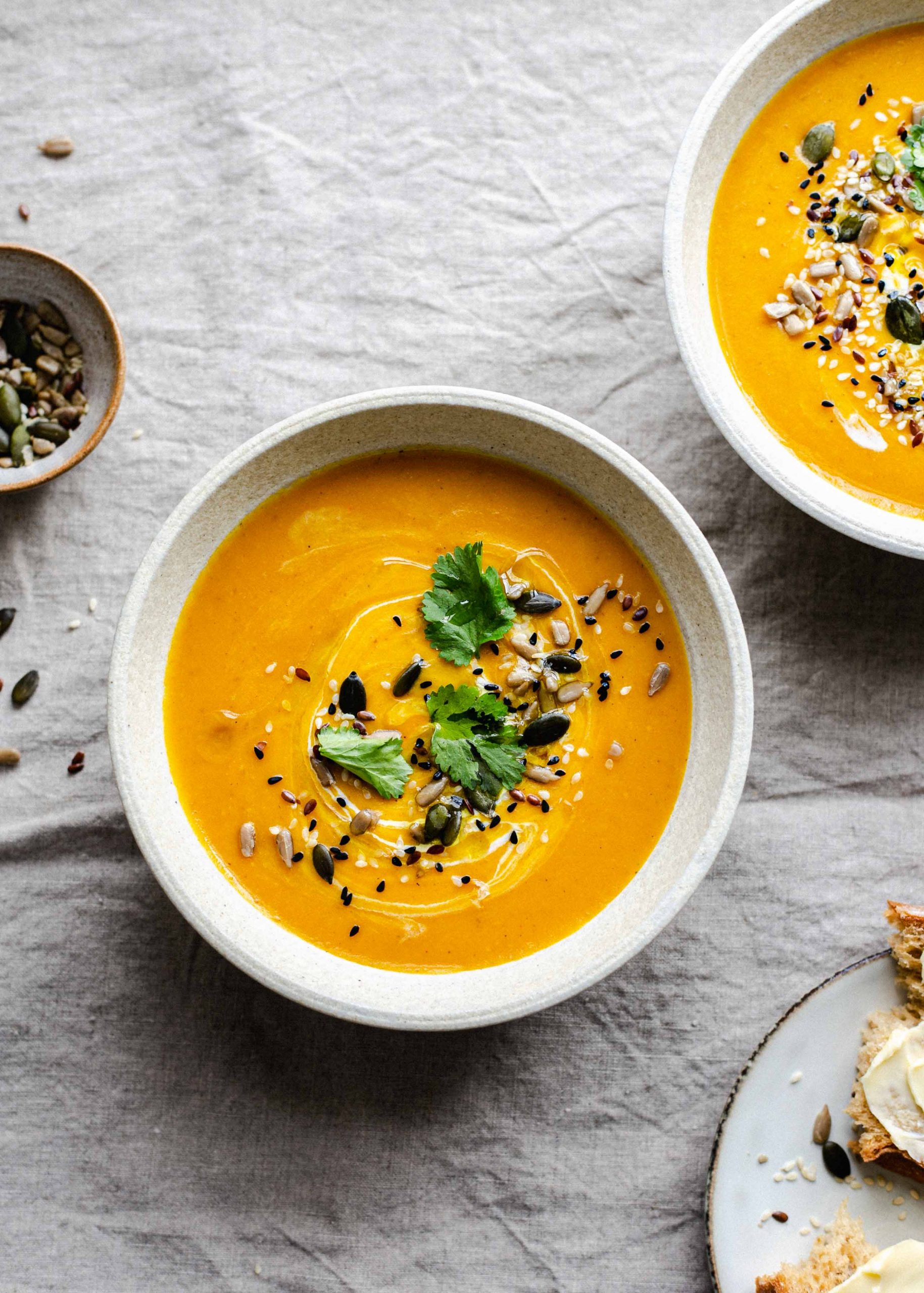 Carrot ginger and coconut soup with seeds and coriander
