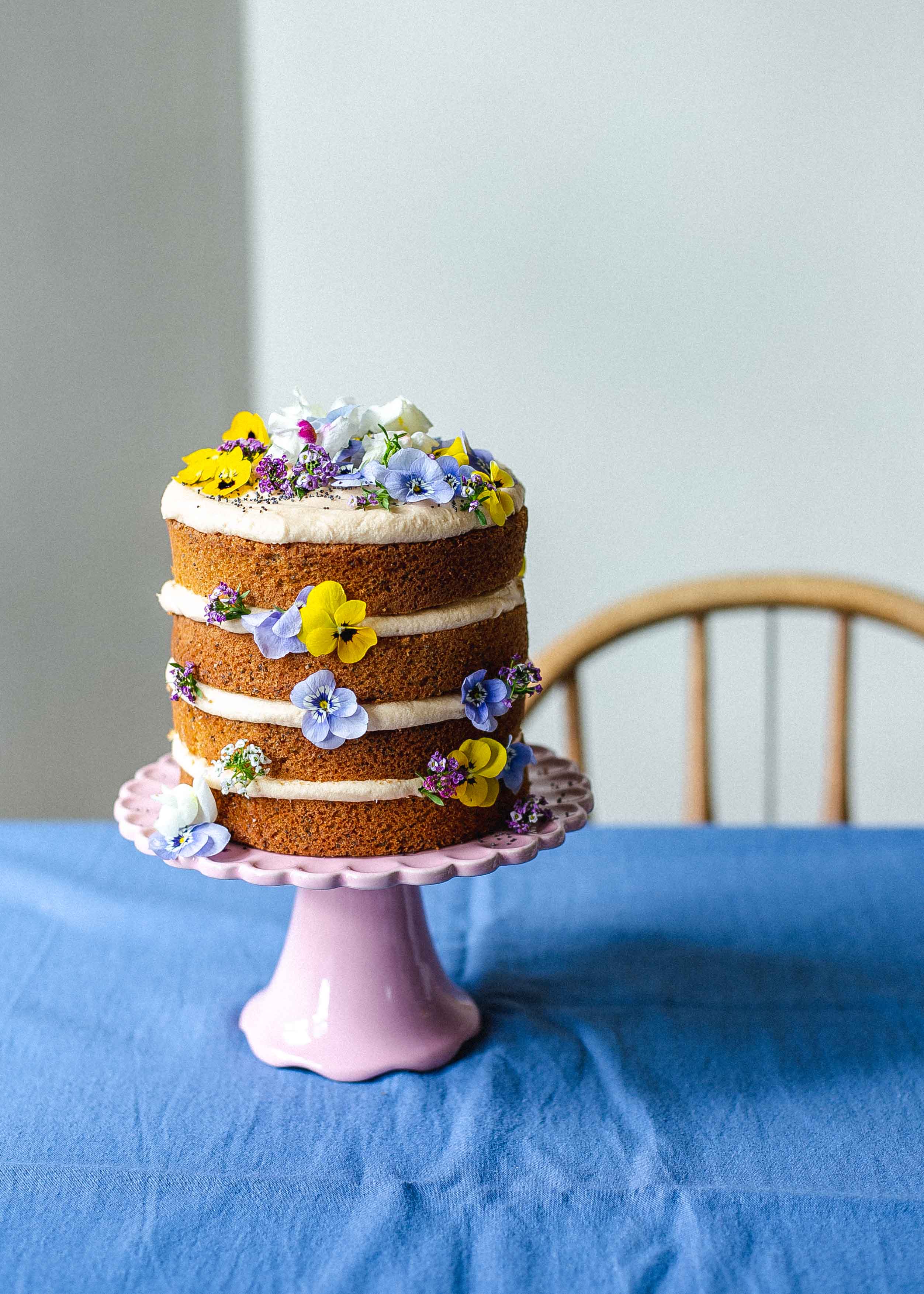 Low FODMAP earl grey, lemon and poppy seed layer cake with edible flowers