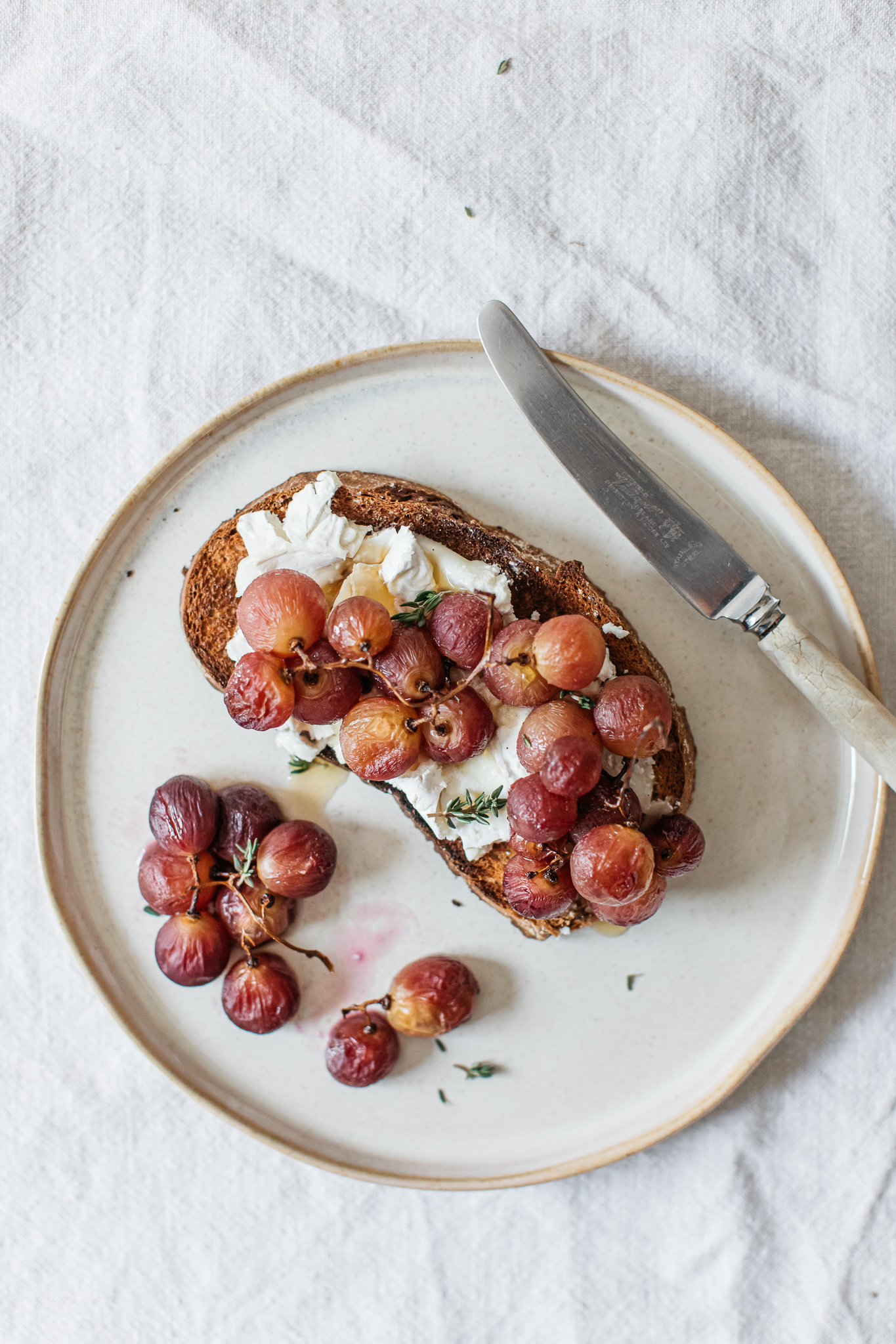 Roasted grapes on toast with thyme
