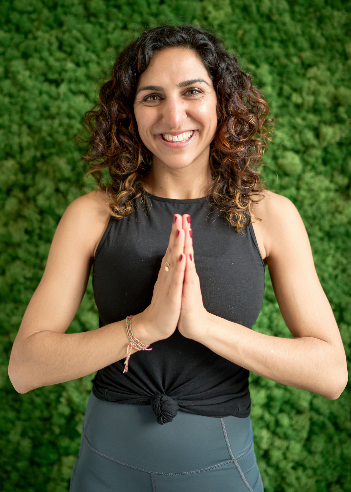 Dr Rabia headshot in yoga position gut health